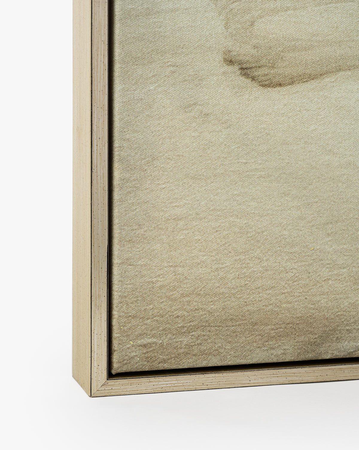 Close-up of the bottom left corner of Neutral Abyss, a gallery-wrapped canvas artwork with a textured beige surface and light oak frame set against a white background, by McGee & Co.