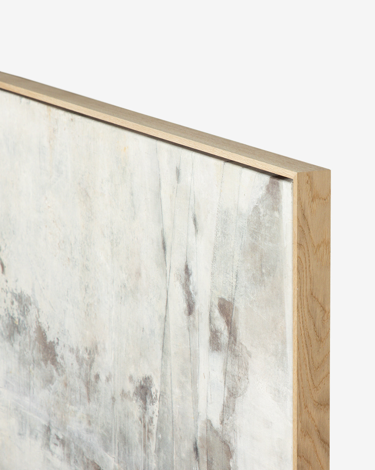 A close-up of Penumbra VI by Matera, a framed abstract acrylic painting with a light wood frame. The artwork displays soft gray and white tones with subtle streaks, set against a plain white background.