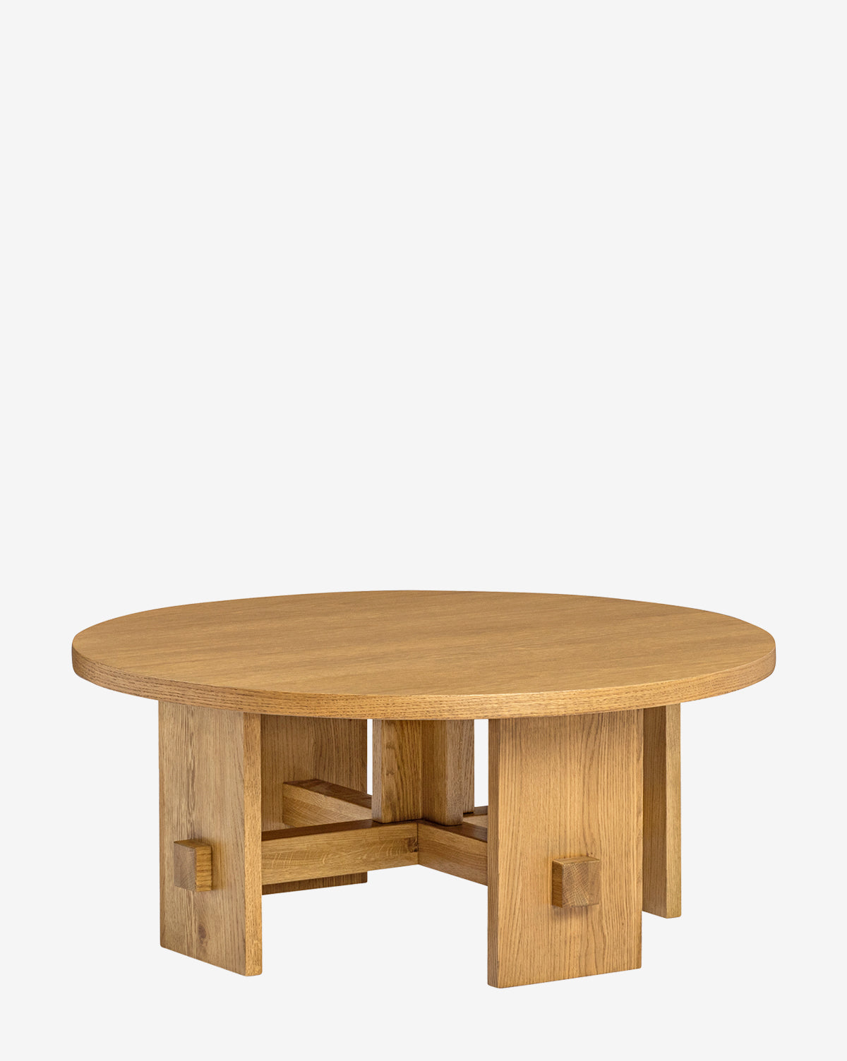 The Newbold Coffee Table features a round oak top with a natural honey finish and a sturdy geometric base of four thick legs with cross-bracing, set against a plain white background, by McGee & Co.