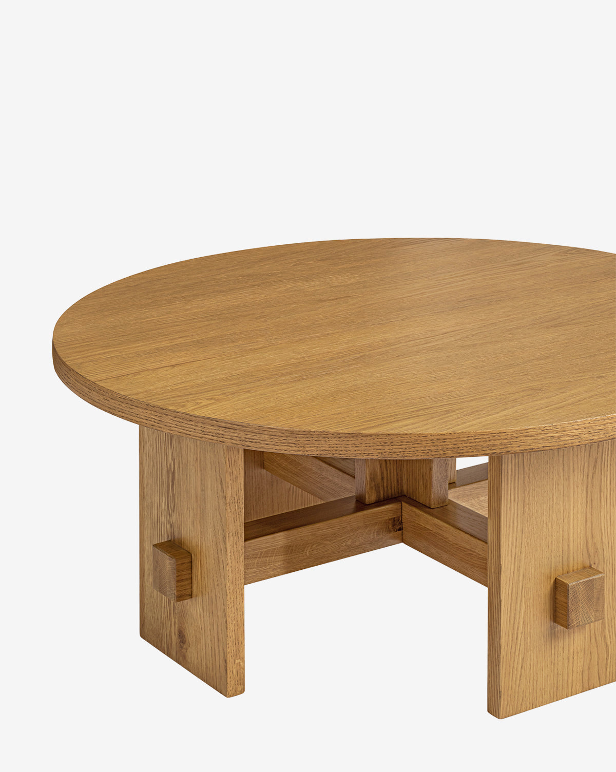 The Newbold Coffee Table showcases a round oak top in a honey finish with sturdy block legs, displayed on a plain white background, by McGee & Co.