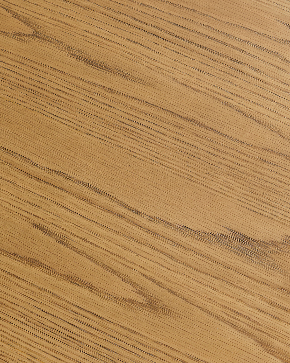 A close-up of the Newbold Dining Table showcases its light brown wooden surface with visible natural grain patterns and warm honey tones, evoking a modern oak design by McGee & Co.