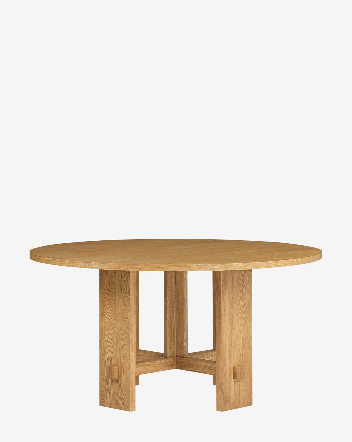 The Newbold Dining Table is a round, modern piece with a smooth top and sturdy geometric base. Four thick rectangular legs are joined by crossbars, while its light natural wood finish adds contemporary appeal by McGee & Co.