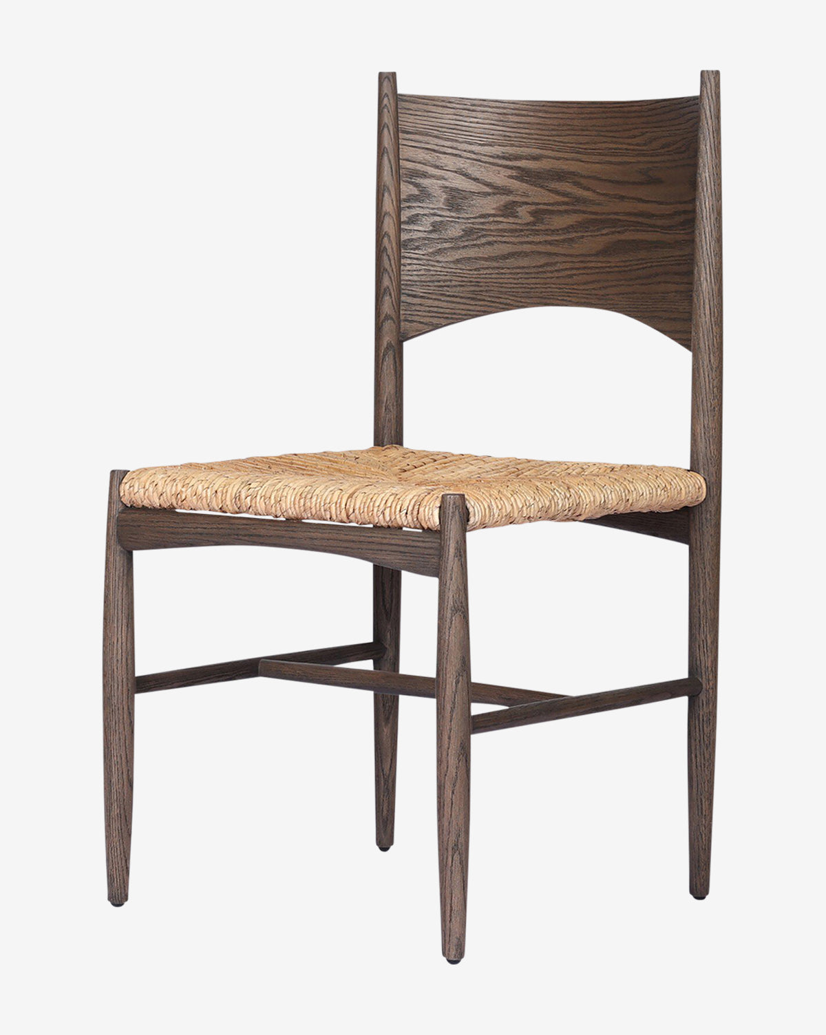 The Nixie Dining Chair features a solid oak frame with a dark stain, a gently curved backrest, and a woven banana leaf seat, shown against a plain white background by McGee & Co.