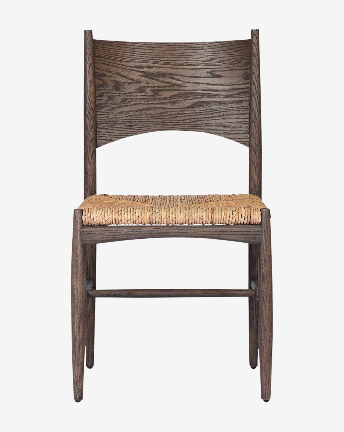 The Nixie Dining Chair features a dark, textured solid oak frame and a woven straw seat. Shown from the front against a plain white background, it has a wide, curved backrest with a natural wood grain pattern by McGee & Co.