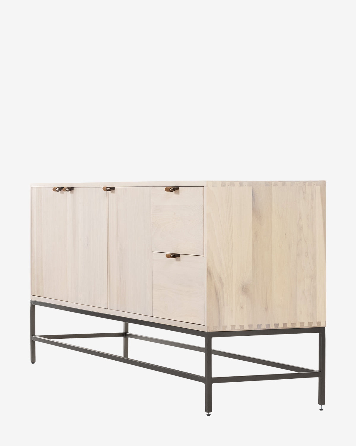 The Noland Sideboard is a modern light wood piece with three doors, two drawers, small round handles, hidden storage, and a black metal frame base, by McGee & Co.