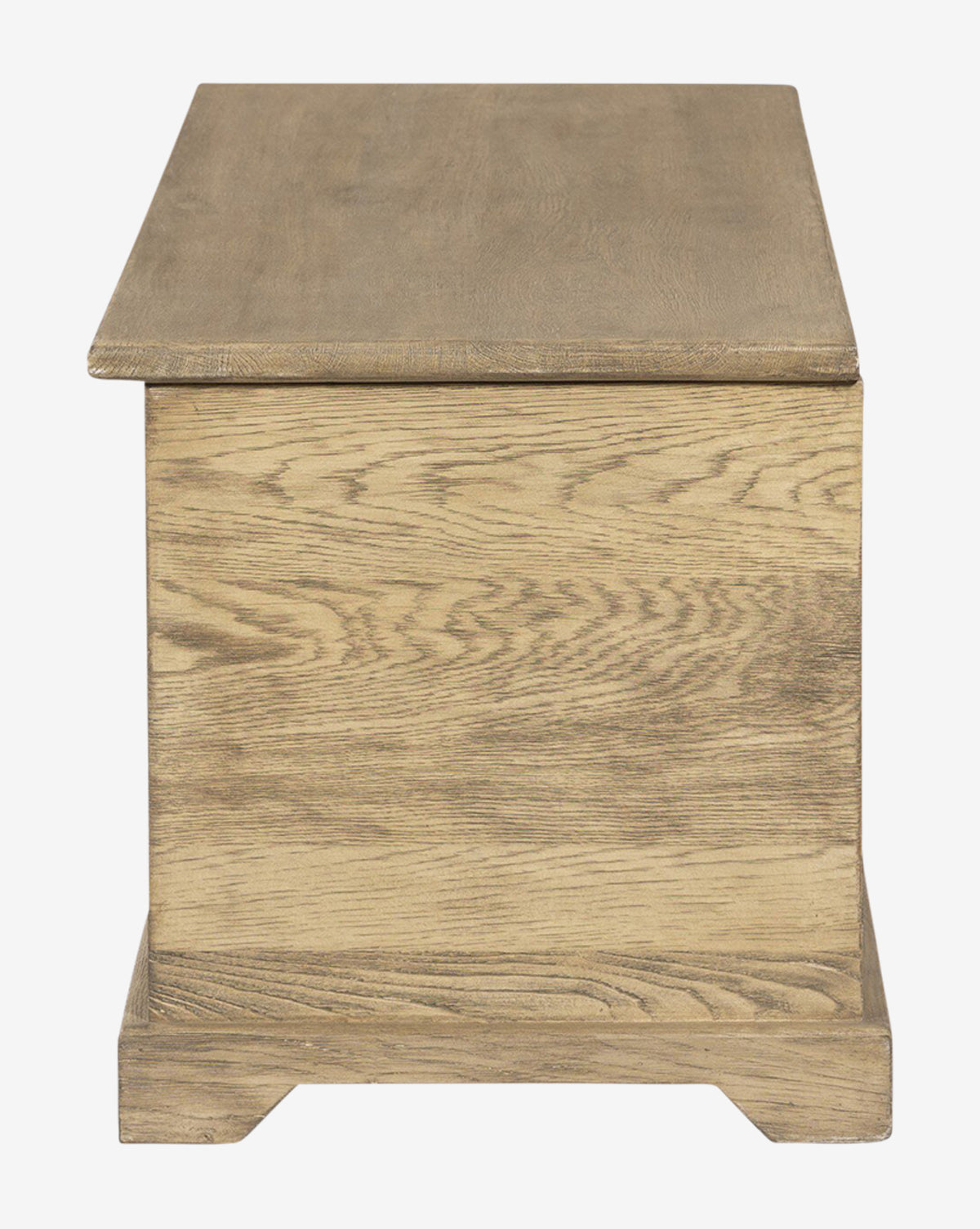 The Norman Bench by Four Hands features a rectangular wooden design with a flat lid, light brown finish, and visible wood grain, combining timeless style with practical storage—blending seamlessly with the curated look of McGee & Co.