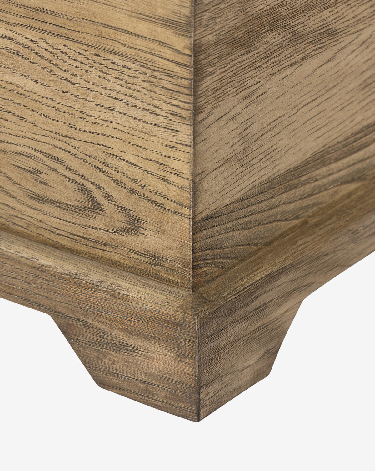 Close-up of the Norman Bench by Four Hands, highlighting the solid oak corner, detailed wood grain, beveled base, and natural light brown finish—McGee & Co.