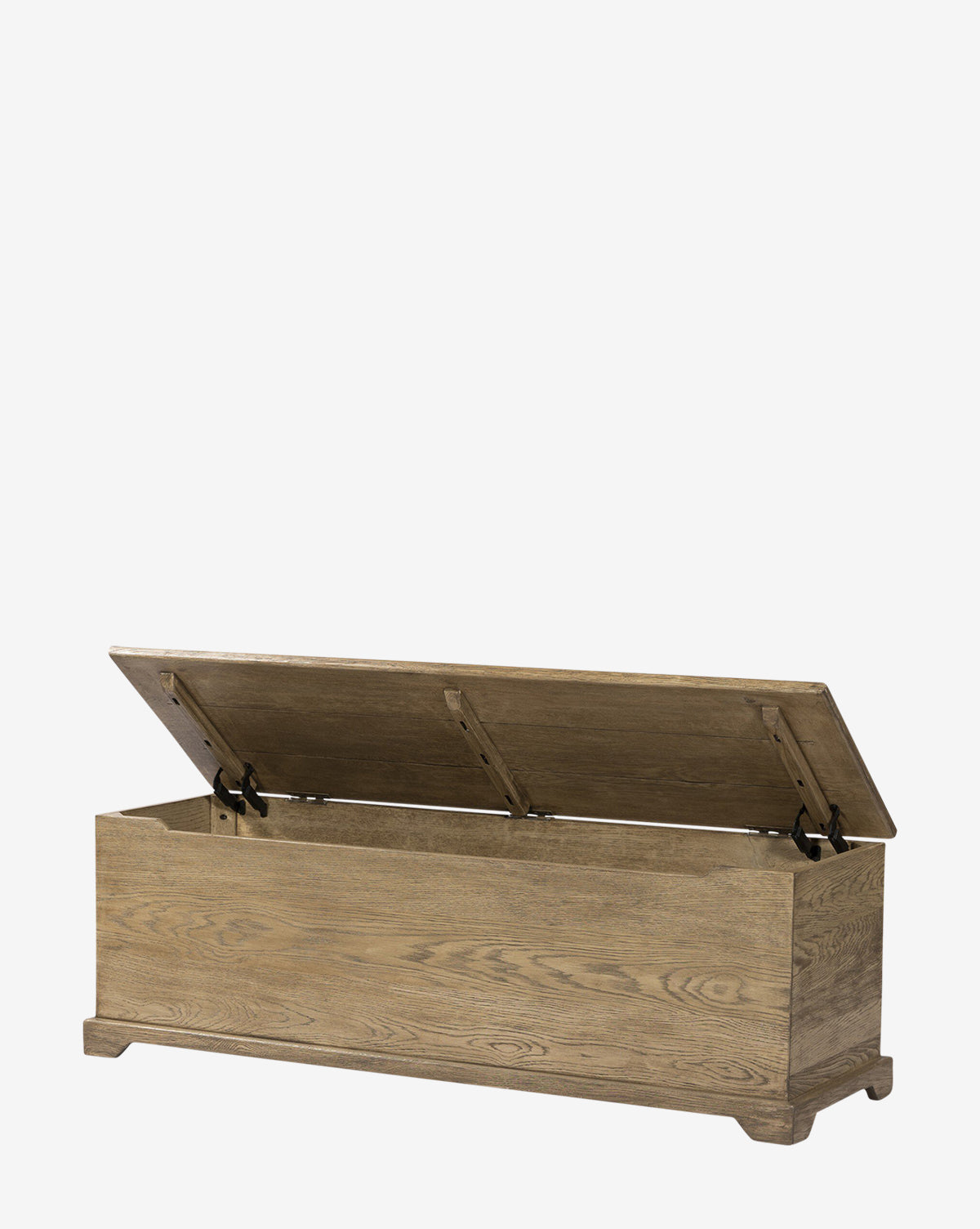 The Norman Bench by Four Hands is a solid oak bench with a hinged lid thats partially open to reveal built-in storage. Featuring a natural wood grain finish, its simple rectangular design and short legs make it ideal as an entryway bench, blending seamlessly with pieces from McGee & Co.