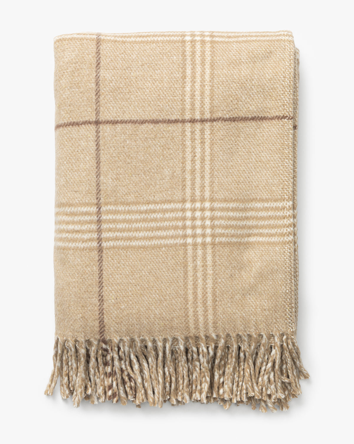 The Nottingham Throw by J Call Designs LLC dba Sew Miami LLC is shown folded in beige wool, featuring a light brown and white plaid pattern with fringed edges on a plain white background. McGee & Co.