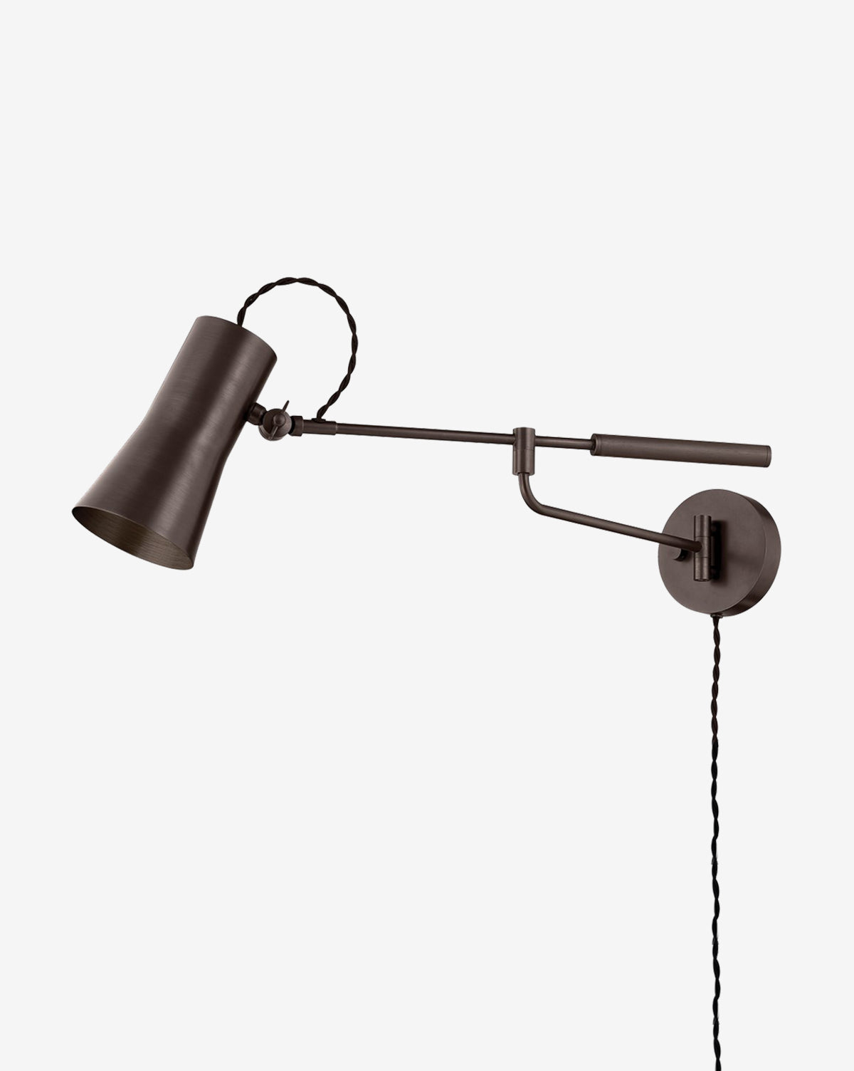 The Novel Sconce by Troy Lighting is an industrial wall light with a dark metal finish, cone-shaped shade, adjustable arm, and exposed twisted cord, shown here against a plain white background, McGee & Co.