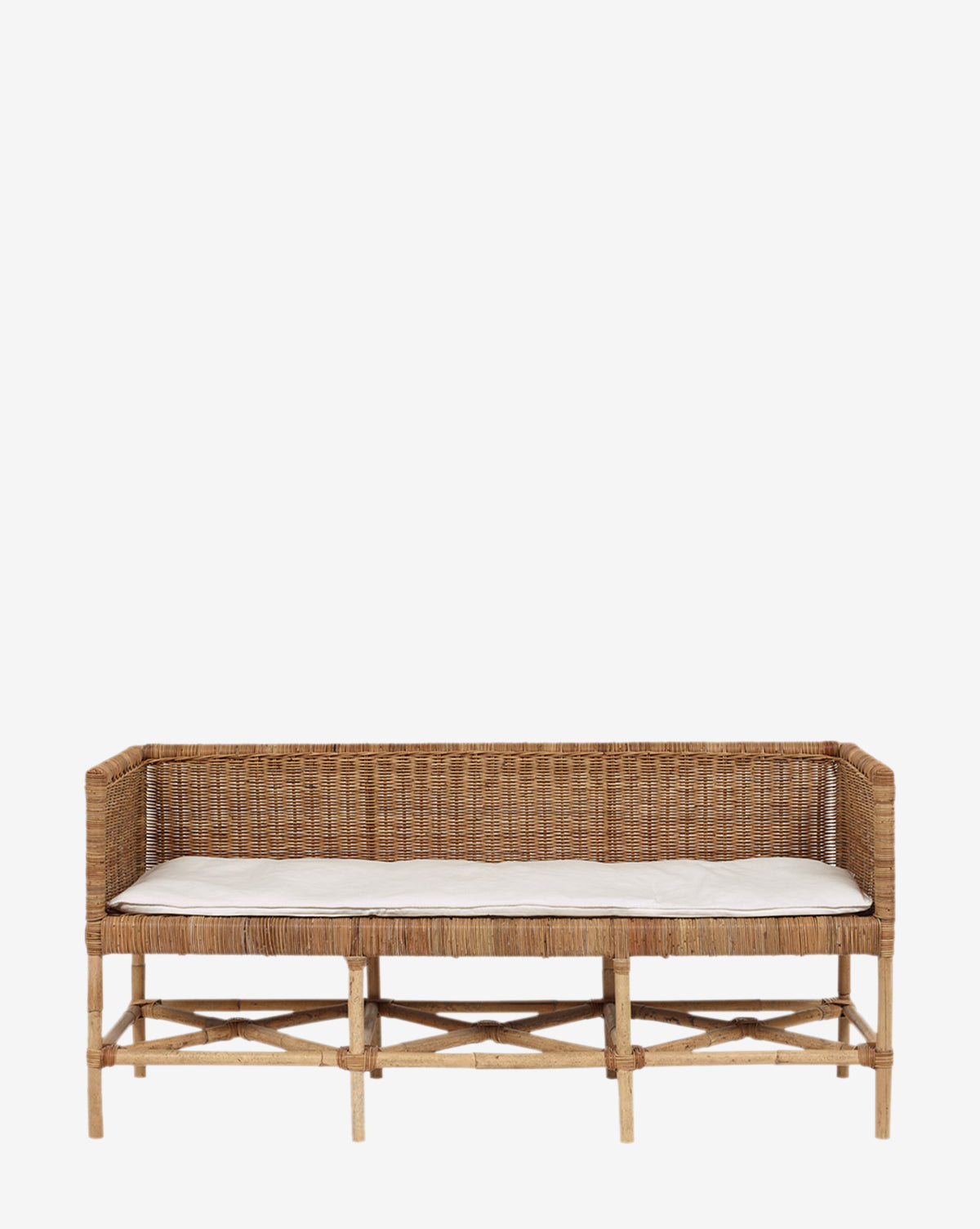 The Odelia Bench features a high back and sides in open-weave rattan, a light seat cushion, and a natural wood finish, all set against a plain white background.