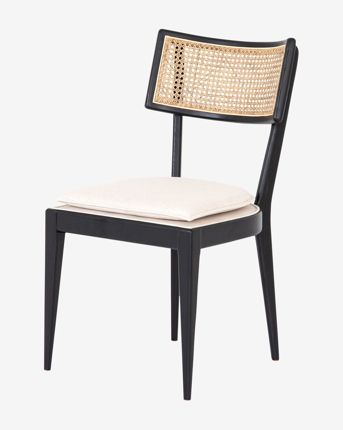 The Odelle Dining Chair features a black wood frame, woven cane backrest, and light beige cushioned seat, showcased in a crisp photo on a plain white background, by McGee & Co.