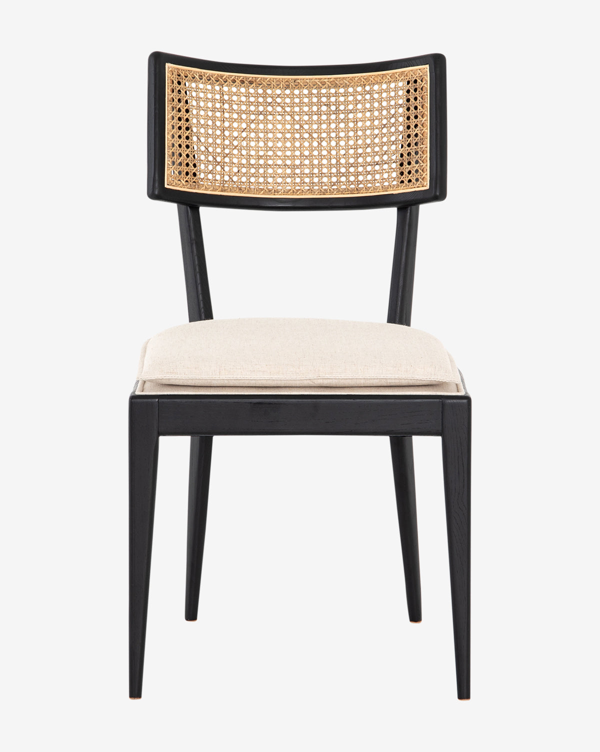 The Odelle Dining Chair has a black wooden frame, cane-inlaid backrest, and light beige cushioned seat. Shown from the front against a plain white background, this modern chair combines comfort with style by McGee & Co.