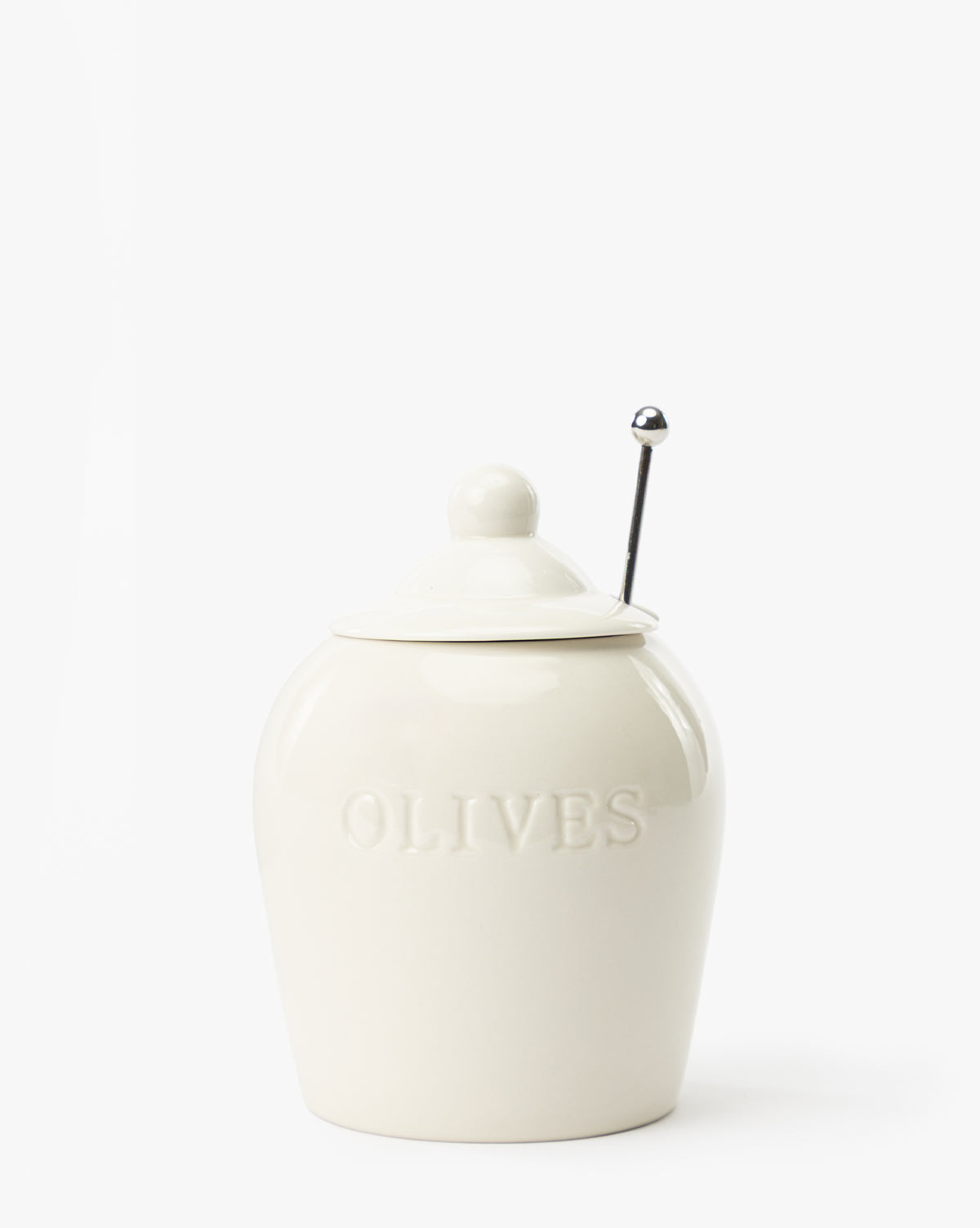 The Olive Stoneware Jar, labeled OLIVES, features an airtight lid and a small slotted spoon emerging from under the lid, displayed against a plain white background by McGee & Co.