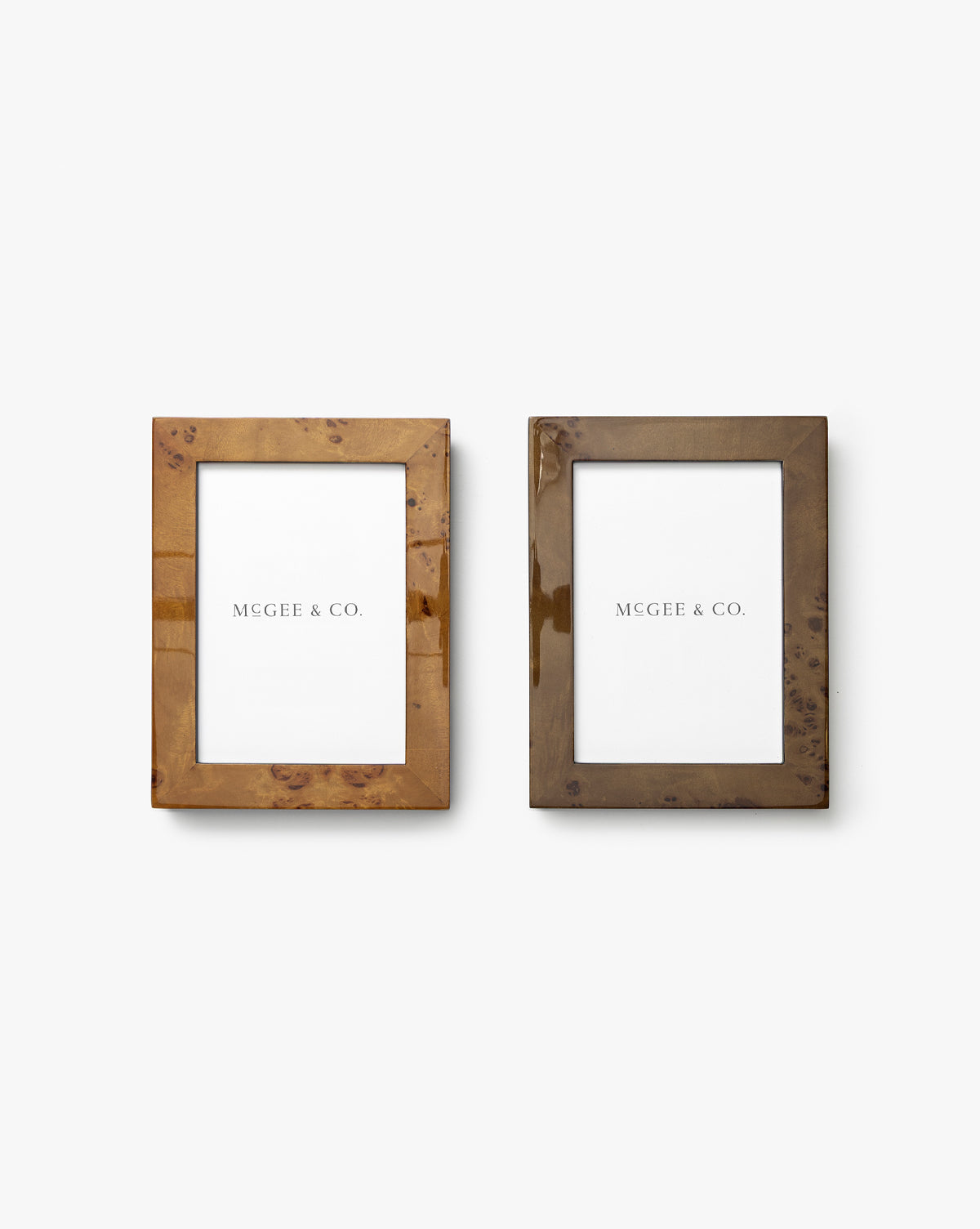 The Oliver Burl 5x7 Frames (Set of 2) feature glossy, marbled brown rectangular designs. Displayed side by side with “MCGEE & CO.” placeholders, these frames add a stylish touch to any home decor by McGee & Co.