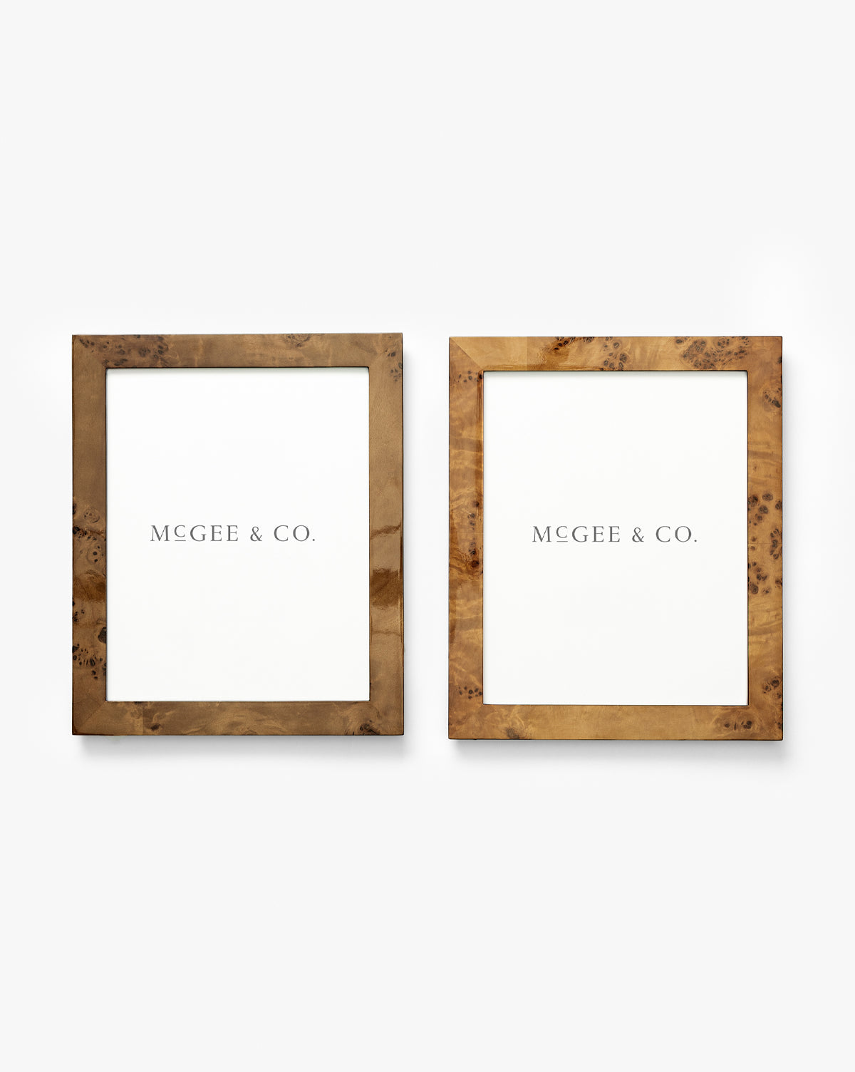 The Oliver Burl 8x10 Frames (Set of 2) feature wooden frames in different brown finishes, each showcasing a white MCGEE & CO. paper and displayed side by side on a plain white background by McGee & Co.