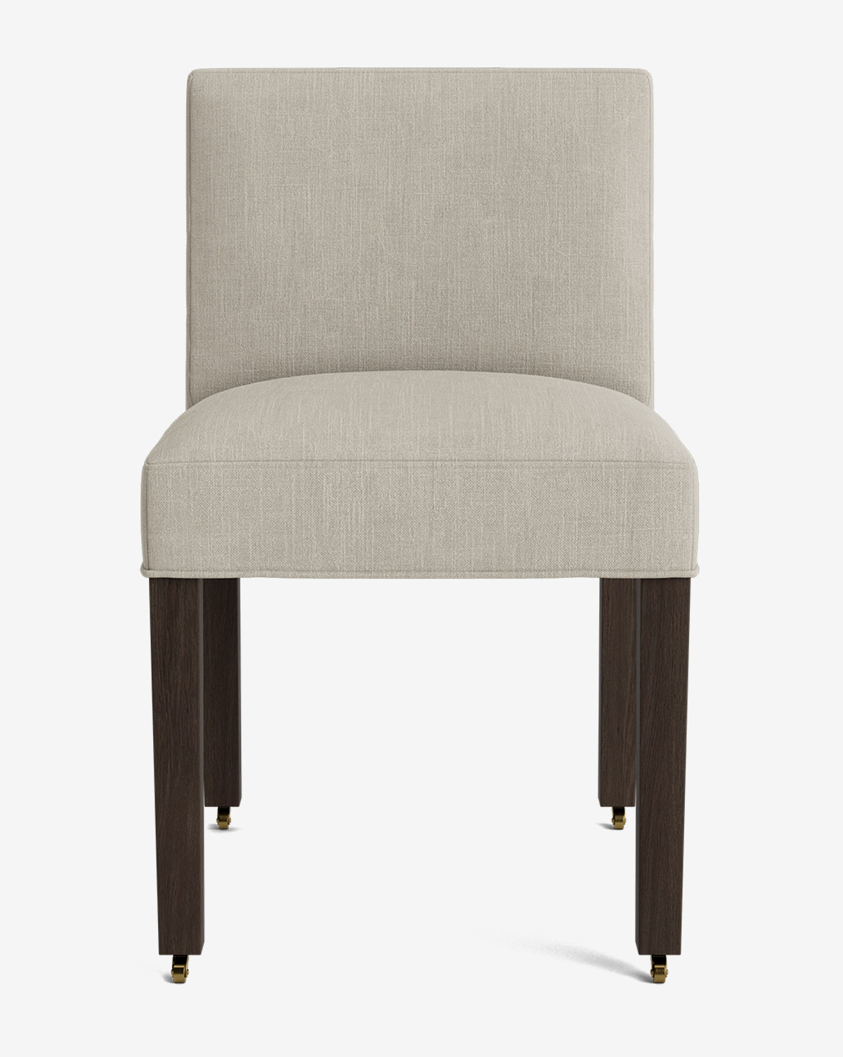 Front view of the Olivier Upholstered Dining Chair featuring a beige high-quality fabric seat and backrest, supported by four dark wooden legs with small brass casters at the bottom, by McGee & Co.
