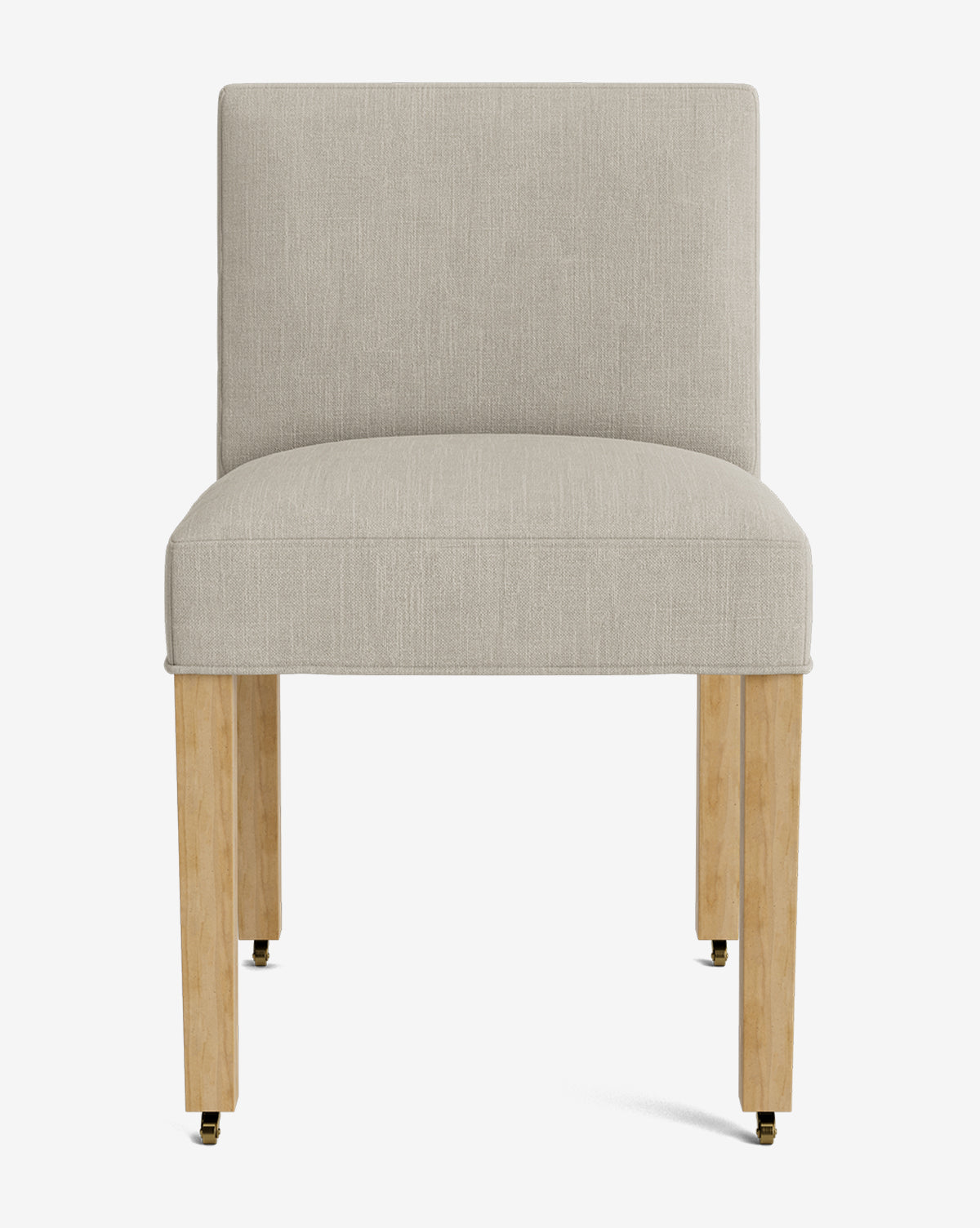 The Olivier Upholstered Dining Chair features a modern armless design, light beige high-quality fabric, wooden legs, and small black and gold casters, shown from the front against a white background by McGee & Co.