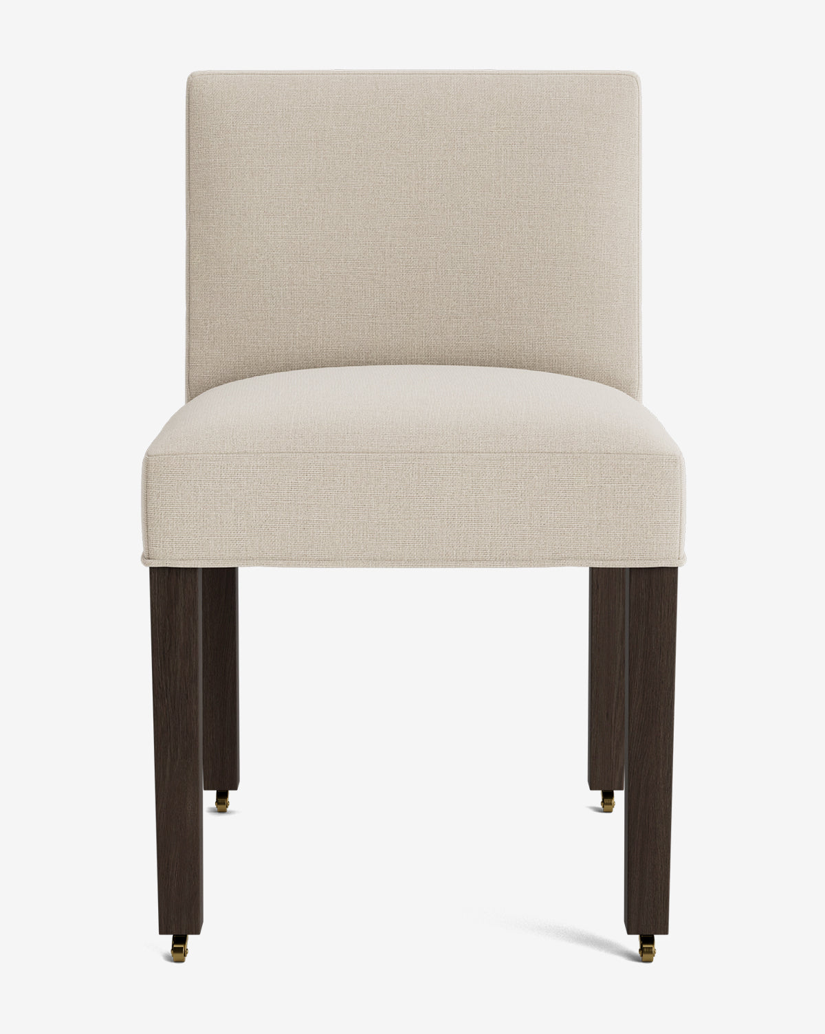 Front view of the Olivier Upholstered Dining Chair featuring a beige high-quality fabric seat and backrest, dark wooden legs, and small brass-colored casters on the front legs, by McGee & Co.