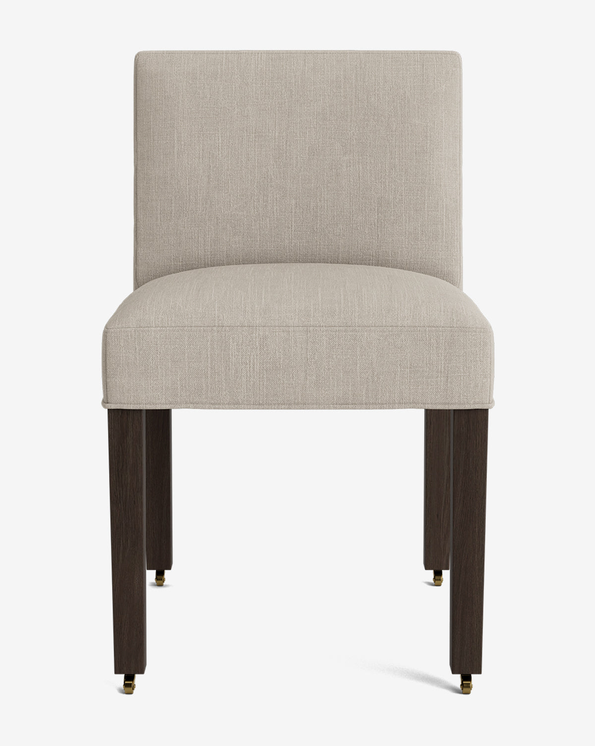 The Olivier Upholstered Dining Chair features a modern design with a light beige fabric seat and backrest, four dark wooden legs with brass-capped feet, and is showcased against a plain white background by McGee & Co.