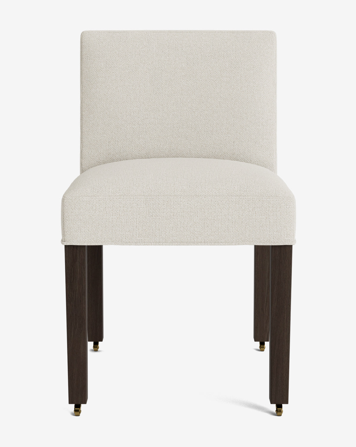 The Olivier Upholstered Dining Chair features a cream, high-quality fabric seat and backrest, four dark wooden legs, and small brass casters on the two front legs for a modern touch, by McGee & Co.