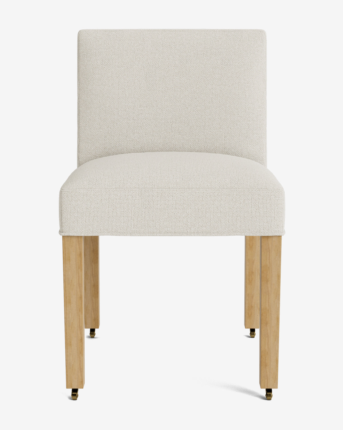 Front view of the Olivier Upholstered Dining Chair, featuring a cream-colored fabric seat and backrest, supported by four light wood legs with small casters at the bottom, by McGee & Co.
