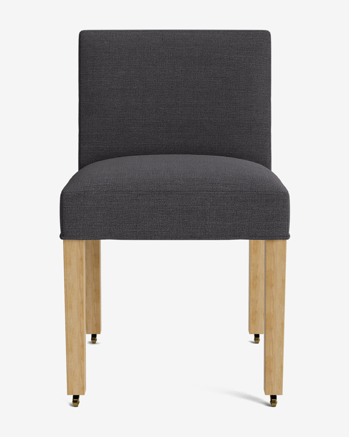The Olivier Upholstered Dining Chair features a modern design with a dark gray, high-quality fabric seat and backrest, supported by four light wood legs with brass-colored caps, by McGee & Co. It is displayed against a plain white background.