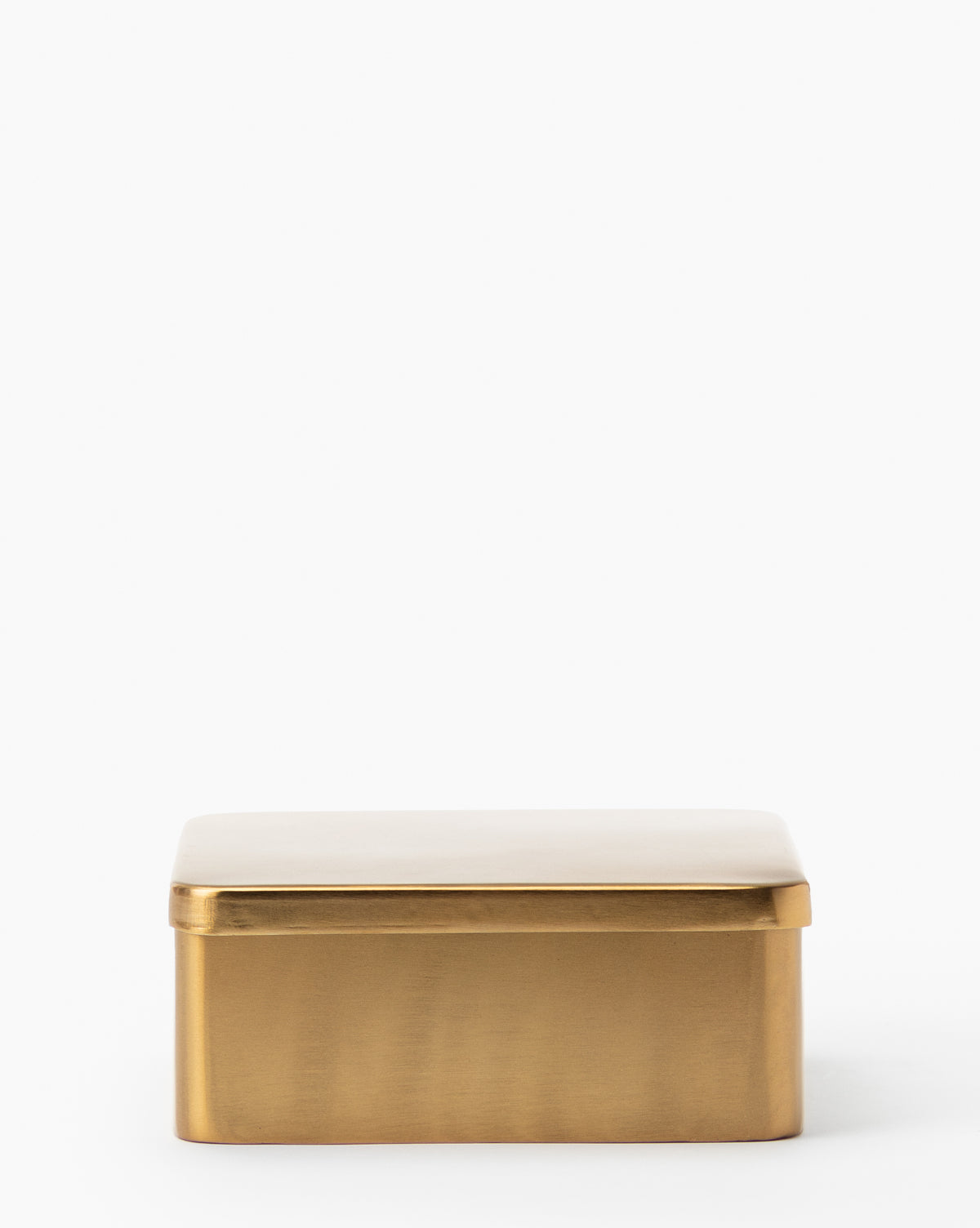 The Oswald Metal Box, featuring a rectangular iron body with a brass finish and flat lid, is shown against a plain white background.