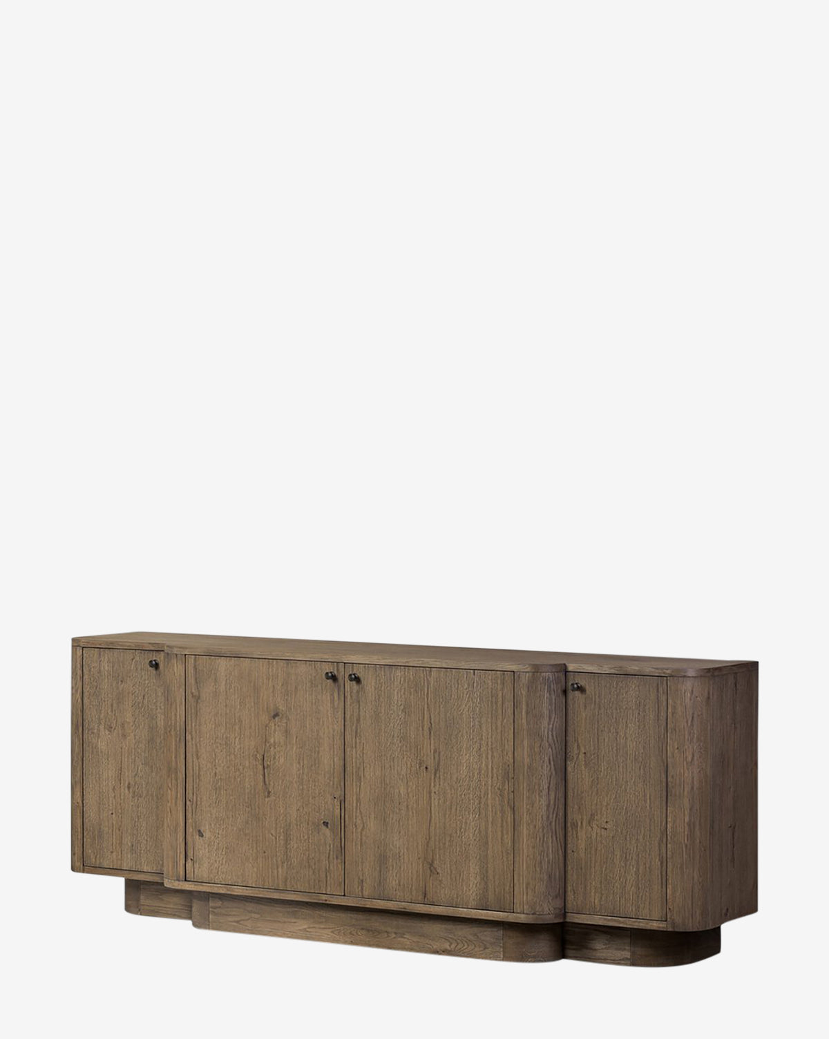 The Oswin Sideboard showcases a modern weathered oak look with a natural finish, break-front design, four cabinet doors, minimalist black handles, and generous storage—all set against a plain white background by McGee & Co.