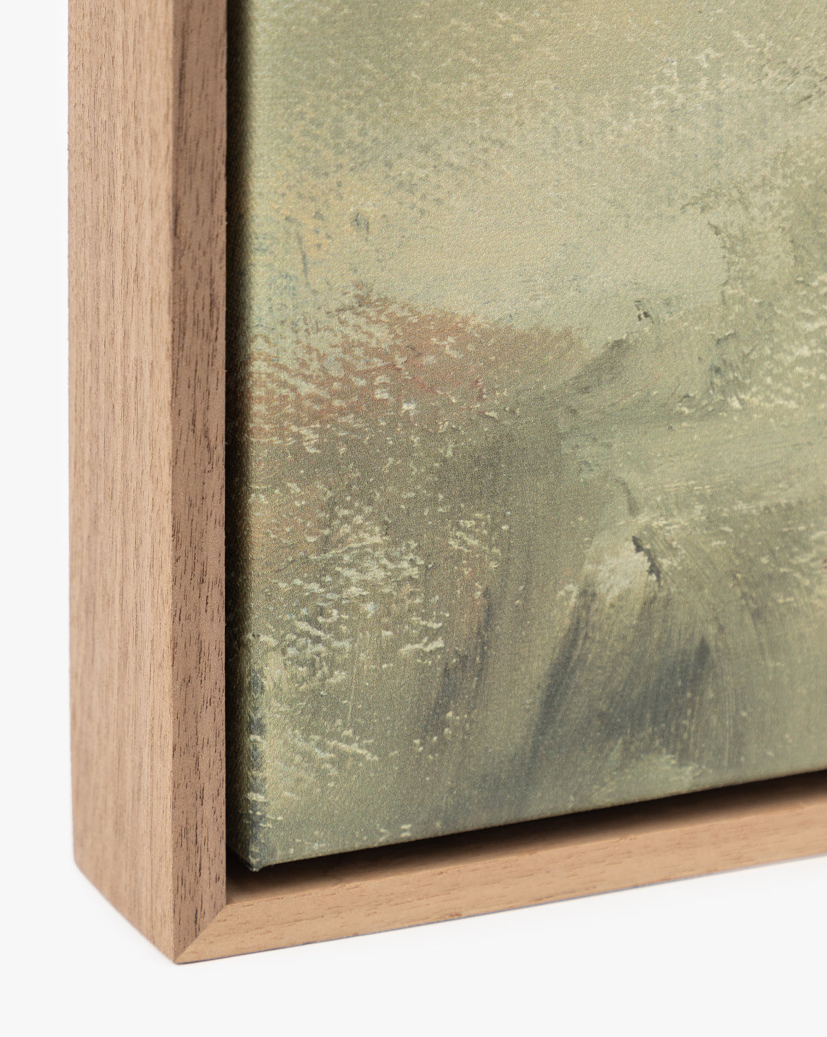 Close-up of Overlook, a canvas artwork in a simple wooden frame, highlights textured brushstrokes in muted green and beige. The natural wood grain adds elegance—ideal for fans of museum-quality wall art by McGee & Co.
