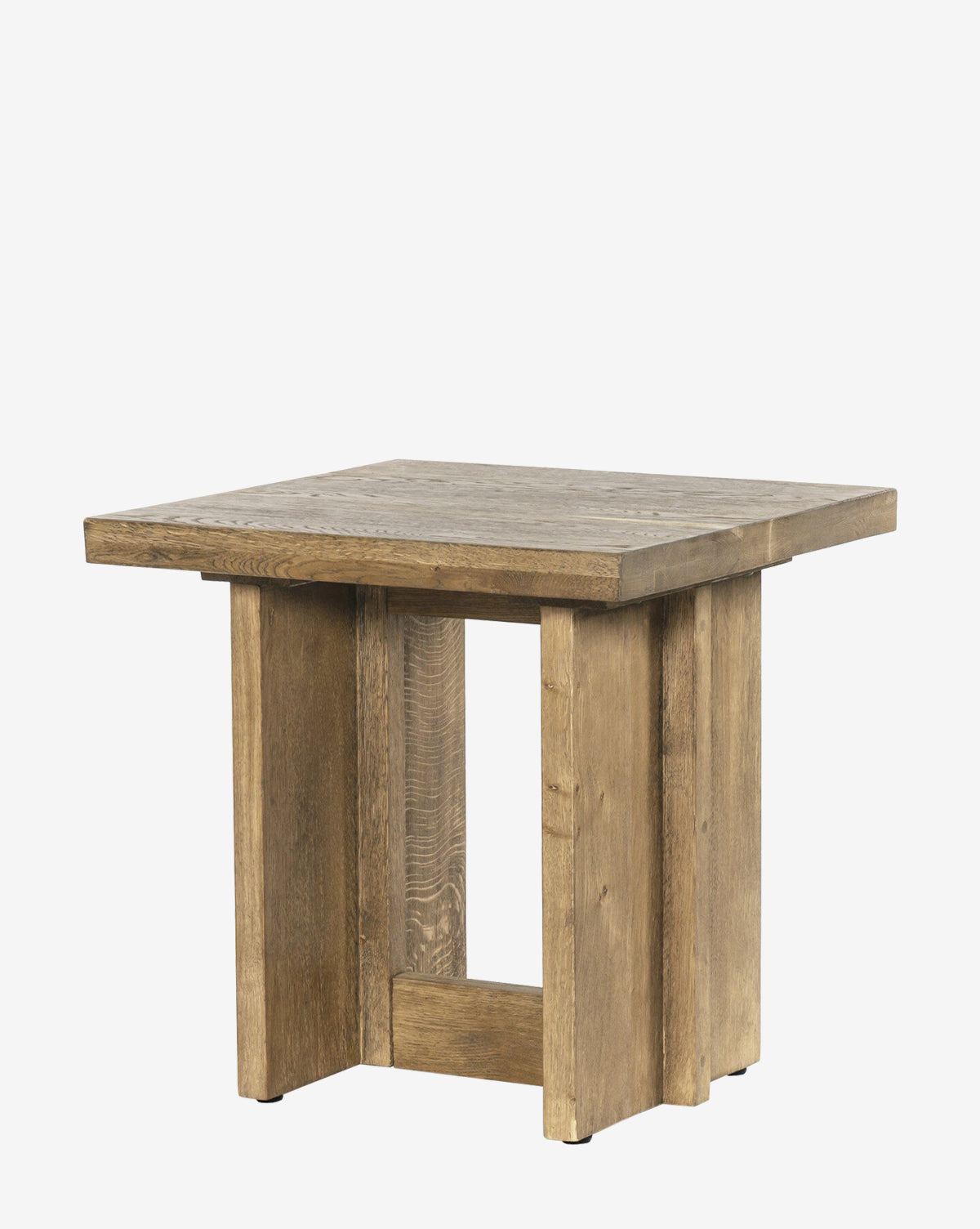 The Ovitt Side Table features a square, block-like design with a thick top, wide sturdy legs, and a natural wood finish that highlights visible grain for a simple rustic look, by McGee & Co.