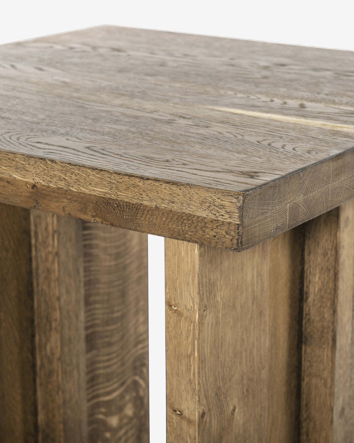 Close-up of the Ovitt Side Table, featuring a rustic, handcrafted design with a square top, sturdy legs, and visible wood grain. The smoked oak finish showcases light to medium brown tones for a natural and timeless look, by McGee & Co.
