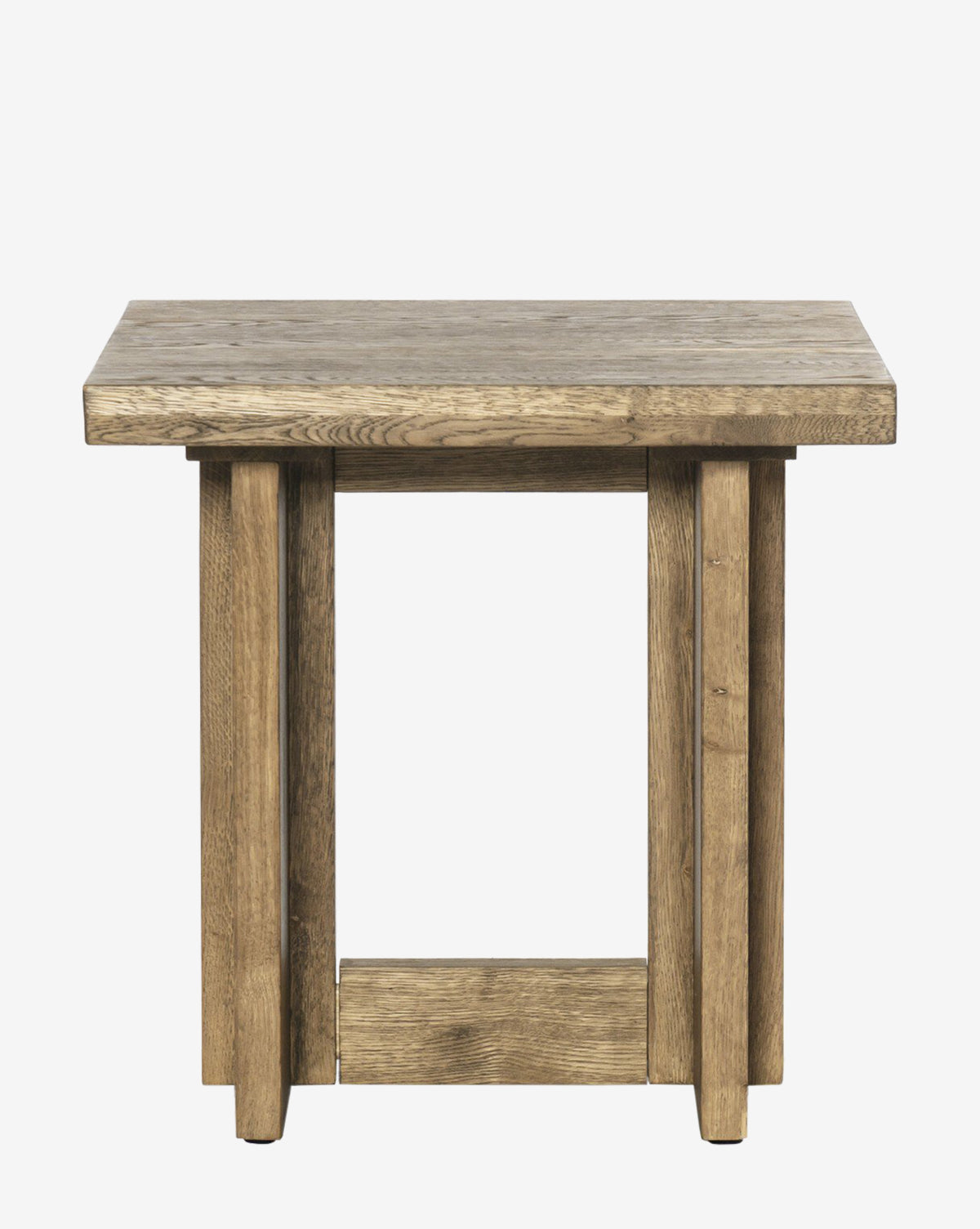 The Ovitt Side Table is square with a thick tabletop, four sturdy rectangular legs, and a bottom support, all finished in natural wood with rustic undertones, by McGee & Co.