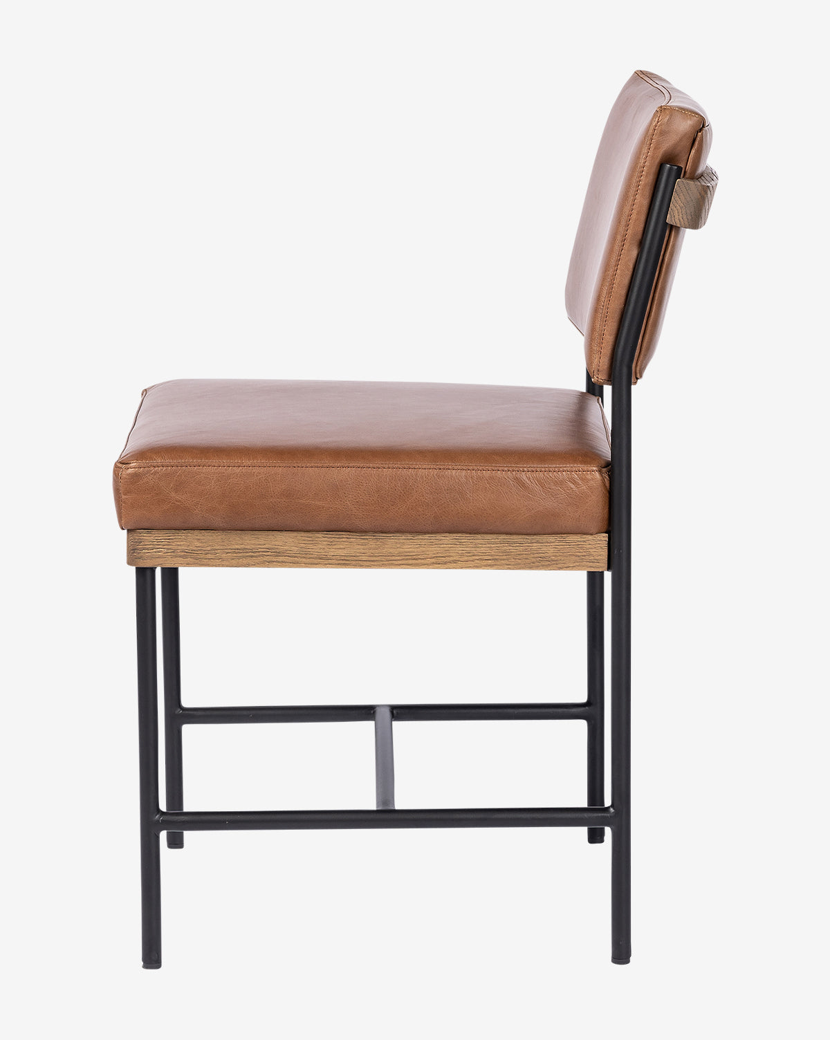 Side view of the Pascal Dining Chair featuring a brown leather cushioned seat and backrest, wooden accent below the seat, and a sleek steel and wood frame, by McGee & Co.