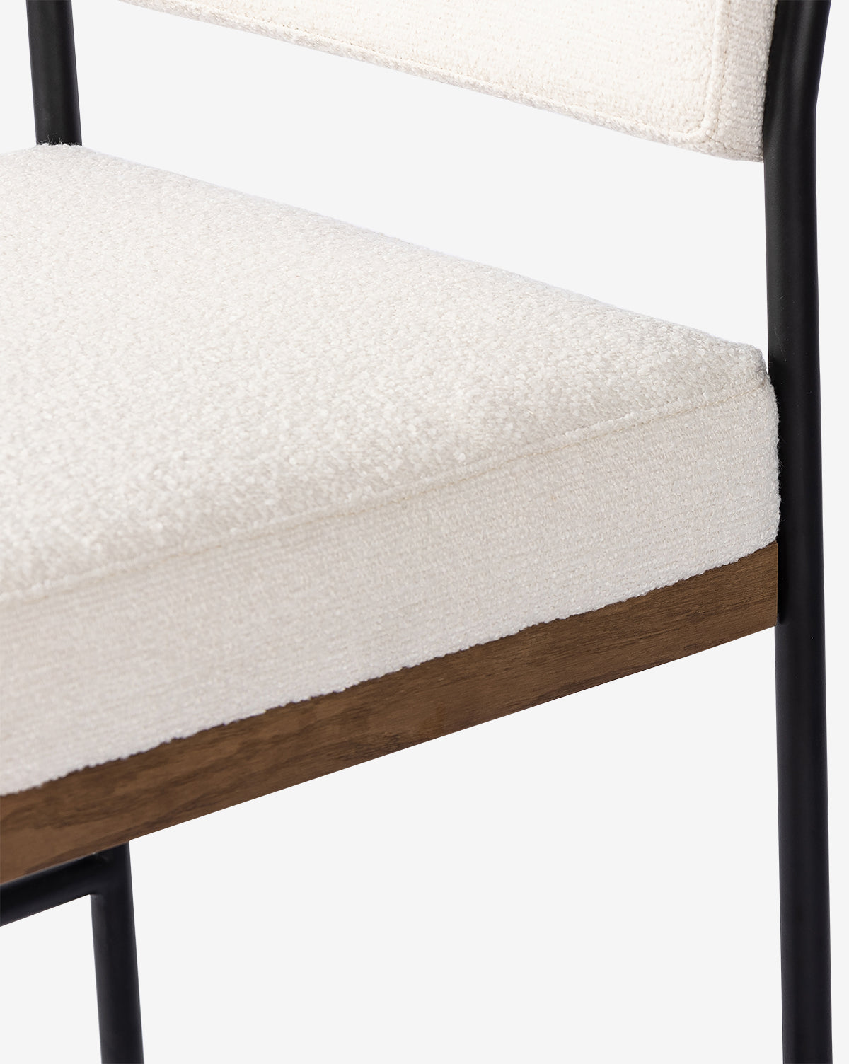 The Pascal Dining Chair features a thick, textured off-white cushion on a wooden seat base with a sleek steel and wood frame—an ideal match for your dining table, by McGee & Co.