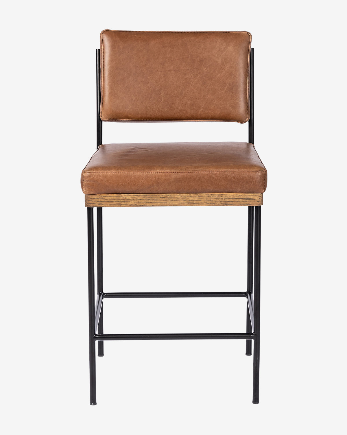 The Pascal Stool has a brown leather seat and backrest, wooden accents, and a black iron frame, by McGee & Co. It is displayed against a plain white background.