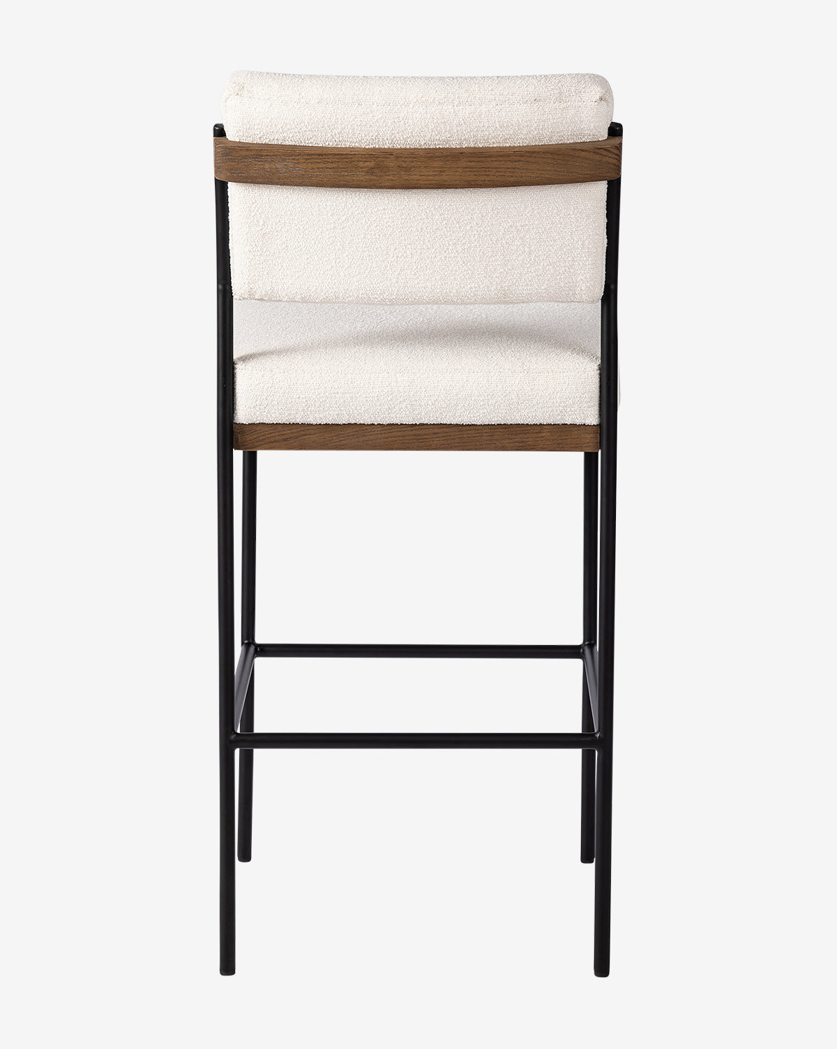 The Pascal Stool combines a black iron frame with an off-white cushioned seat and backrest, featuring wooden accents on the backrest’s top and bottom edges, as viewed from behind, by McGee & Co.