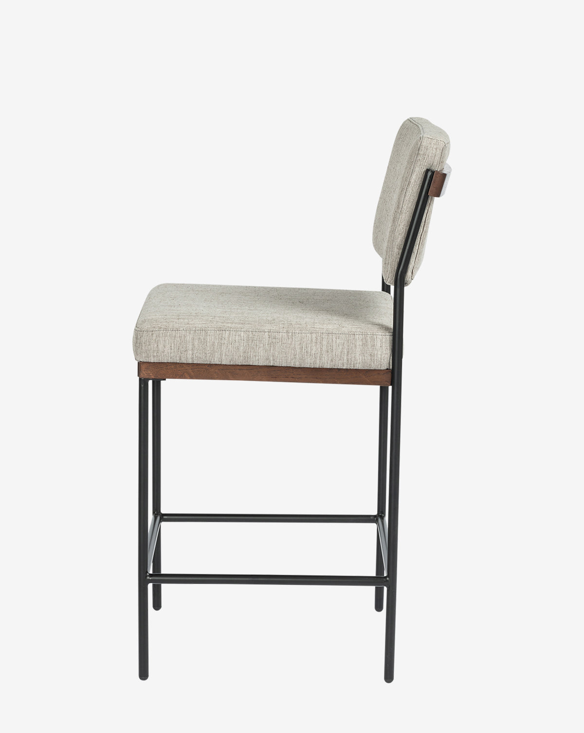 Side view of the Pascal Stool—a versatile chair with a light gray upholstered seat and backrest, supported by a sturdy black iron frame featuring four legs connected by horizontal bars for added stability, by McGee & Co.