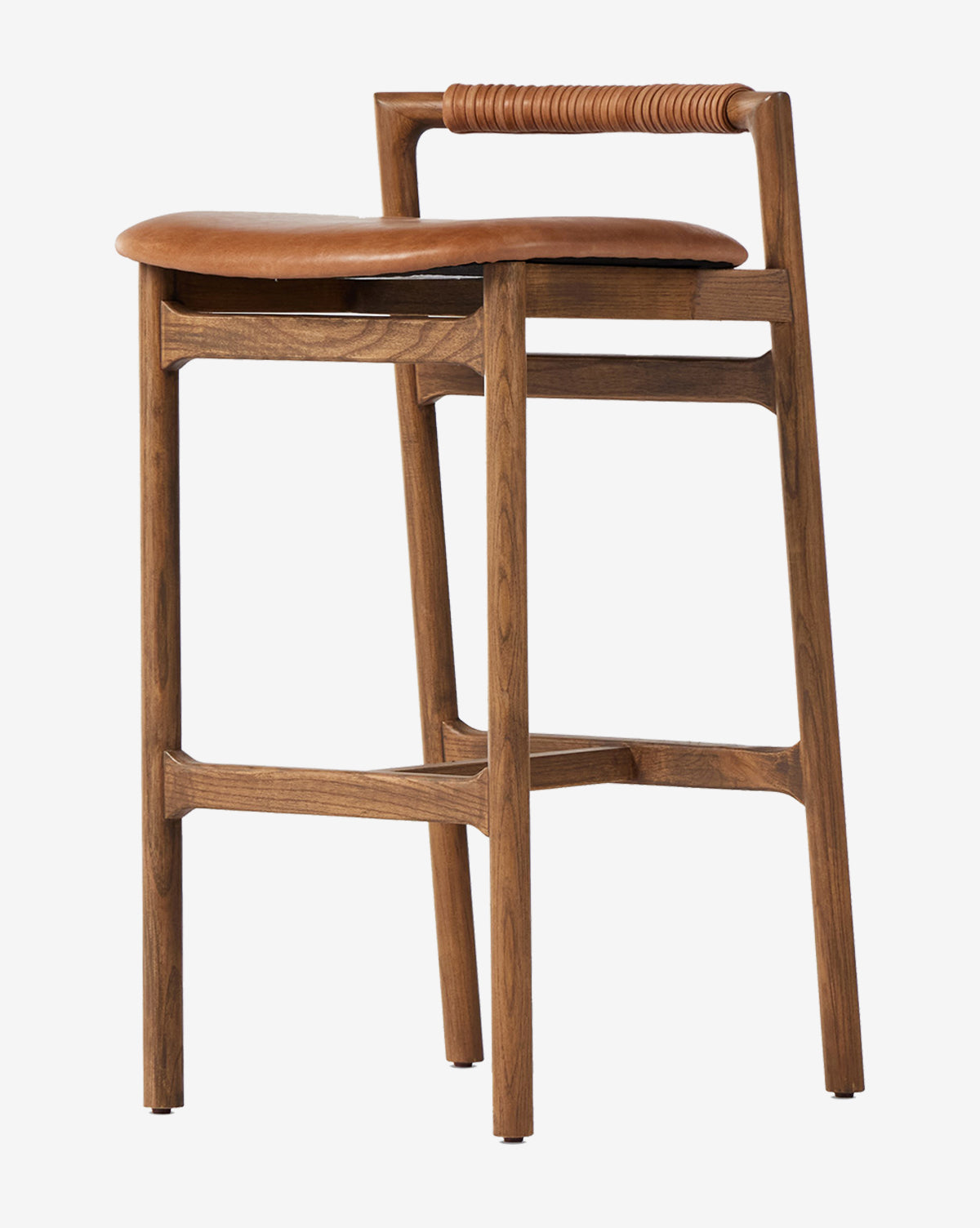 The Patrin Stool by Four Hands showcases a modern ash wood frame, brown leather performance upholstery, a low wrapped backrest design, and four legs with support bars by McGee & Co.