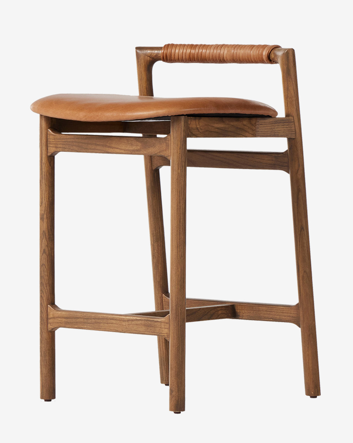 The Four Hands Patrin Stool showcases a modern ash wood frame, tan performance seat, and leather-wrapped backrest, combining clean lines with a minimalist design by McGee & Co.