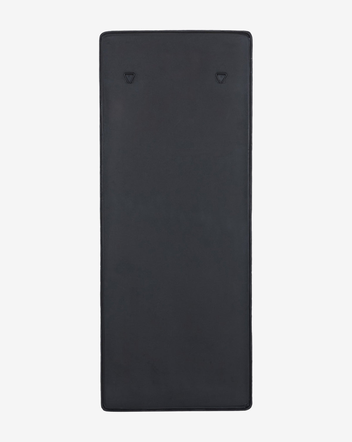 The Penrod Floor Mirror features a sleek black rectangular design, shown laid flat on a light background with two small triangular embossments near the top, adding a sculptural touch that complements modern home décor, by McGee & Co.