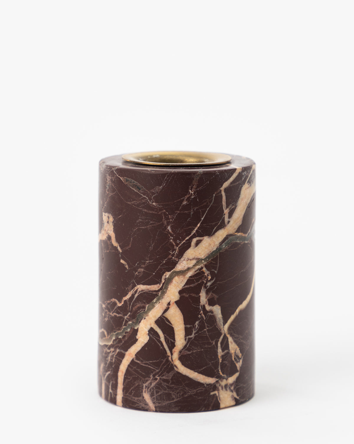 The Perrin Marble Taper Holders (Set of 2) are cylindrical with a dark brown marble base, beige and light brown veining, and a brass cap on top, shown against a plain white background.