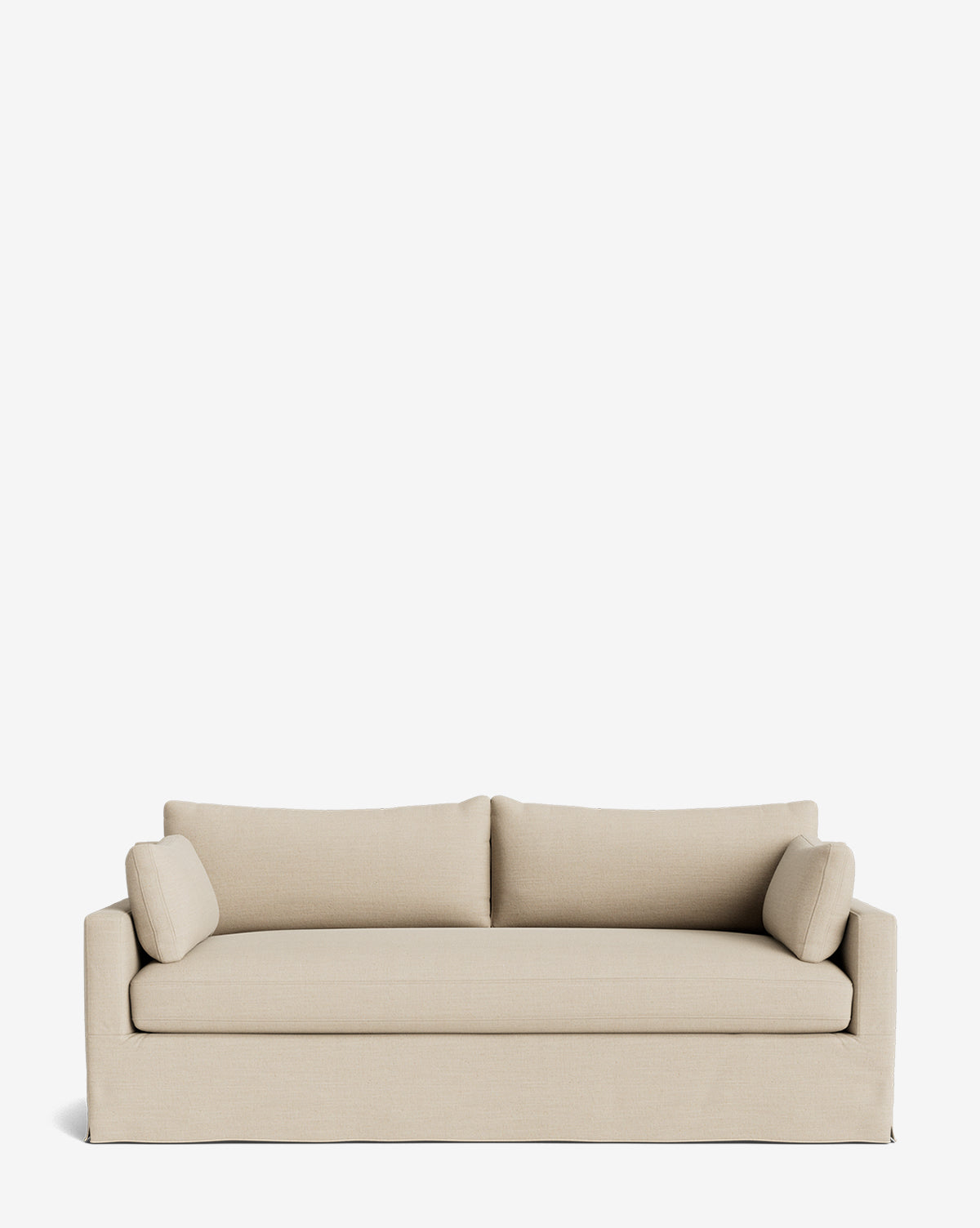 A beige Peterson Classic Slipcover Sofa (75-100) with straight arms, feather blend cushions, two matching back cushions, and cylindrical side pillows is set against a plain white background by McGee & Co.