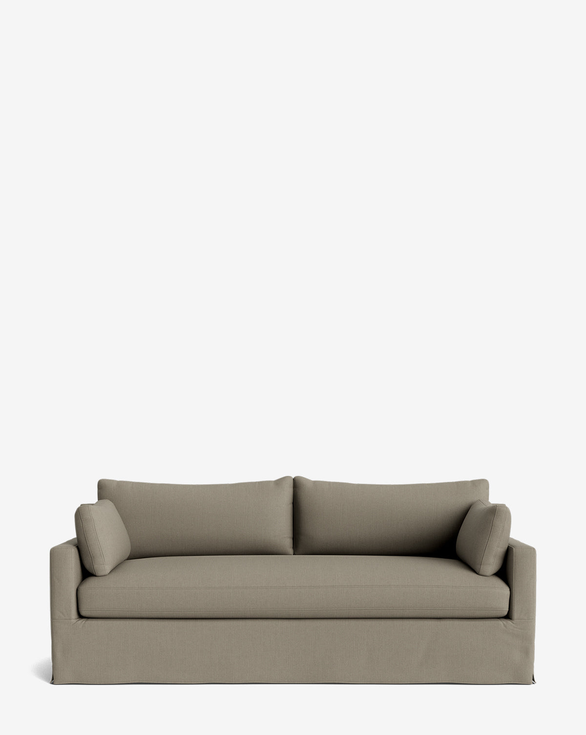 A modern taupe Peterson Classic Slipcover Sofa (75-100) with straight arms, feather blend cushions, and two cylindrical bolster pillows is set against a plain white background, by McGee & Co.