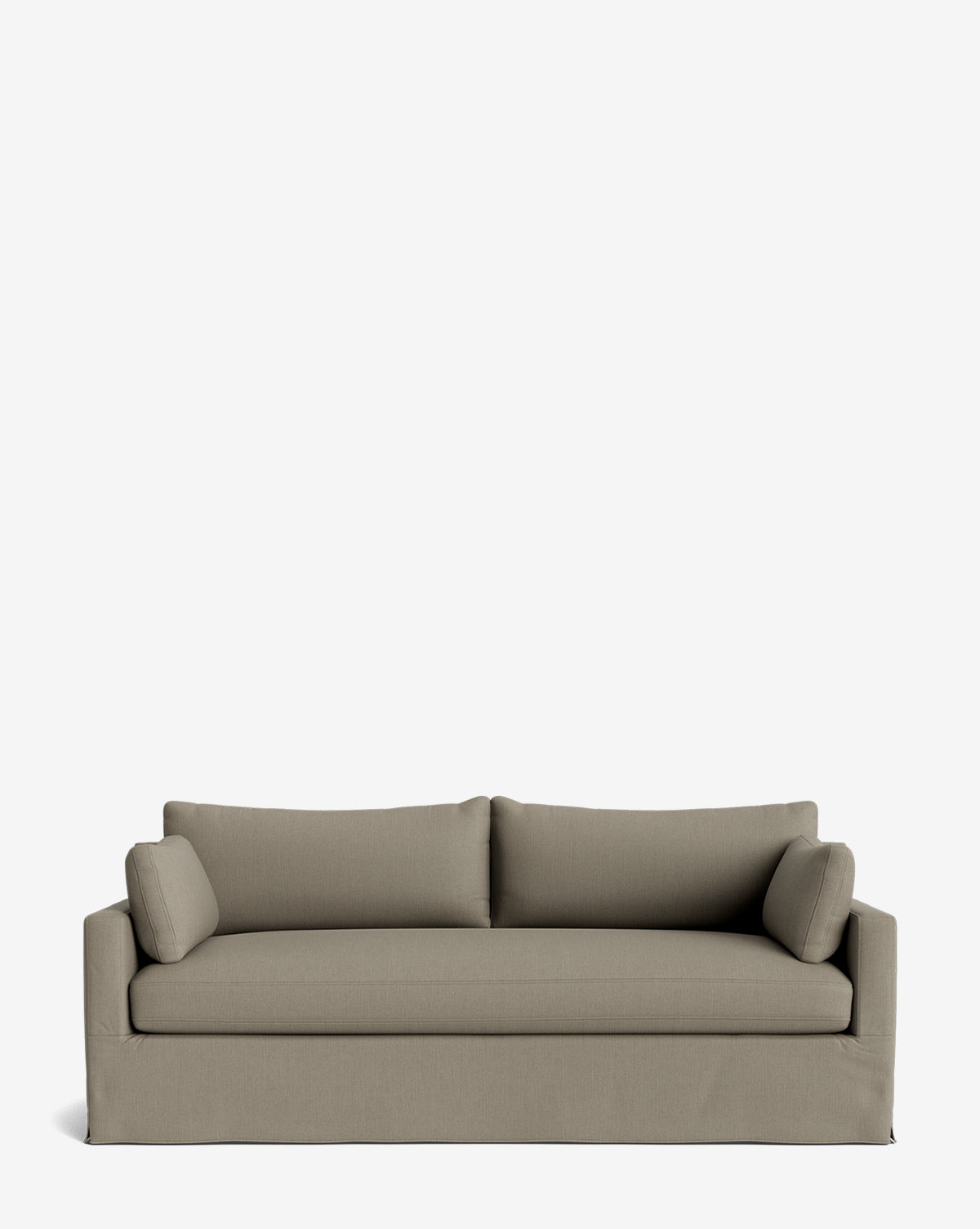 A light brown Peterson Classic Slipcover Sofa (75-100) with feather blend cushions, two seat cushions, two backrest cushions, and two cylindrical side pillows, shown against a plain white background by McGee & Co.