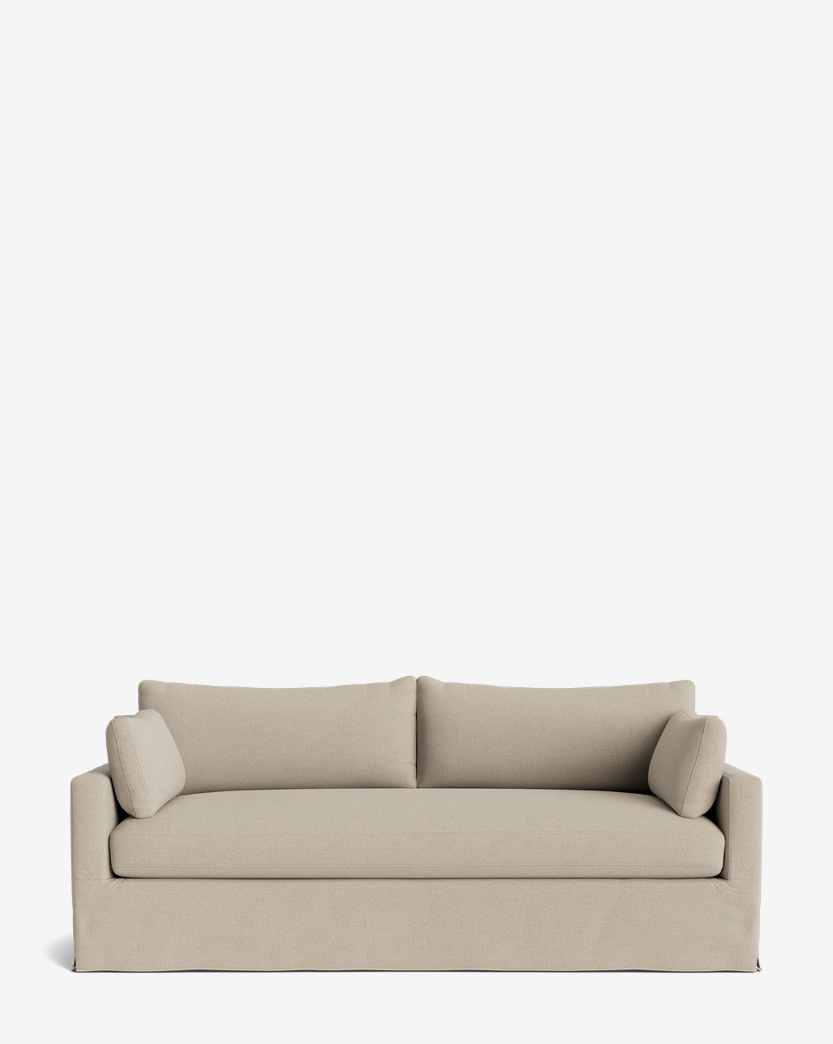 A beige Peterson Classic Slipcover Sofa (75-100) with straight arms, two feather blend back cushions, and two cylindrical side pillows is set against a plain white background by McGee & Co.