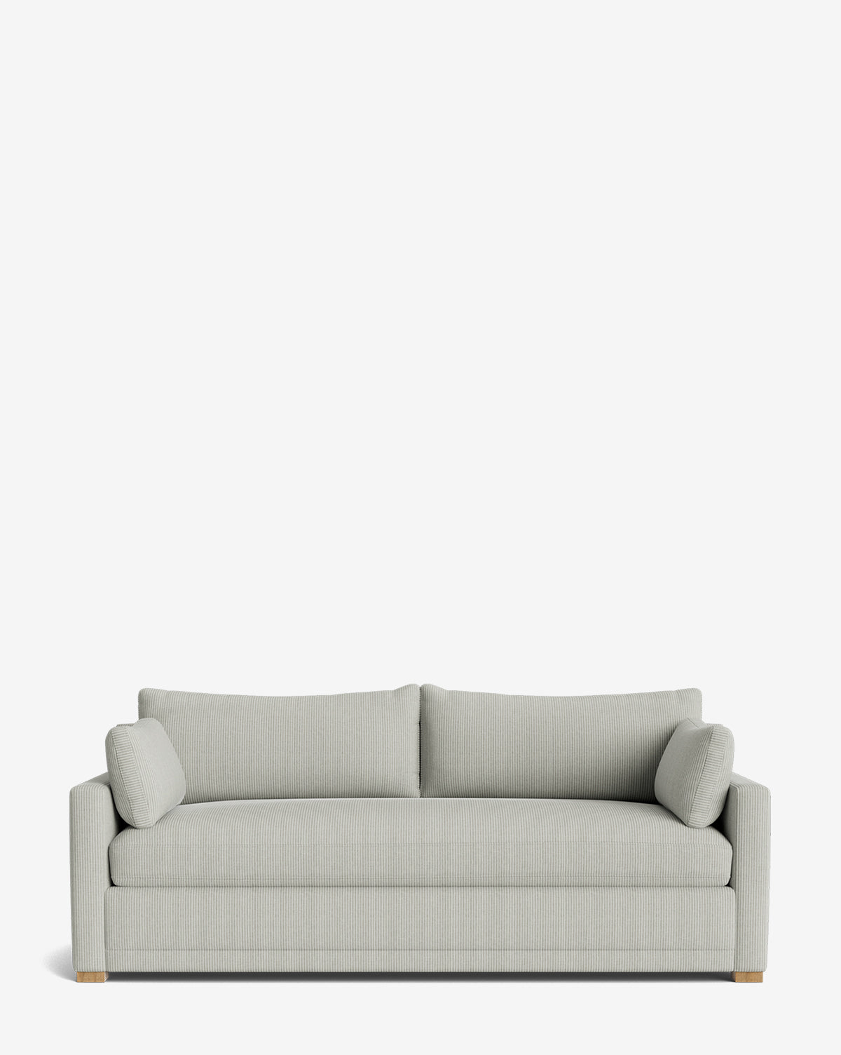 The Peterson Classic Upholstered Sofa (75 - 100) features light gray fabric, plush cushions, two matching bolster pillows, wooden block feet, and straight arms—all set against a plain white background for a clean, modern look by McGee & Co.