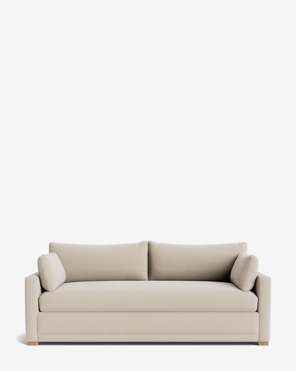 The Peterson Classic Upholstered Sofa (75 - 100) features a modern beige design with straight arms, handcrafted details, two plush seat cushions, two back cushions, and two cylindrical side pillows, shown on a plain white background by McGee & Co.