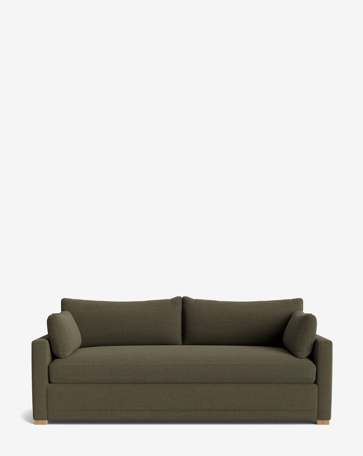 The Peterson Classic Upholstered Sofa (75 - 100) features dark green upholstery, clean lines, handcrafted details, two plush back cushions, two matching bolster pillows, and wooden feet, shown against a plain white background by McGee & Co.