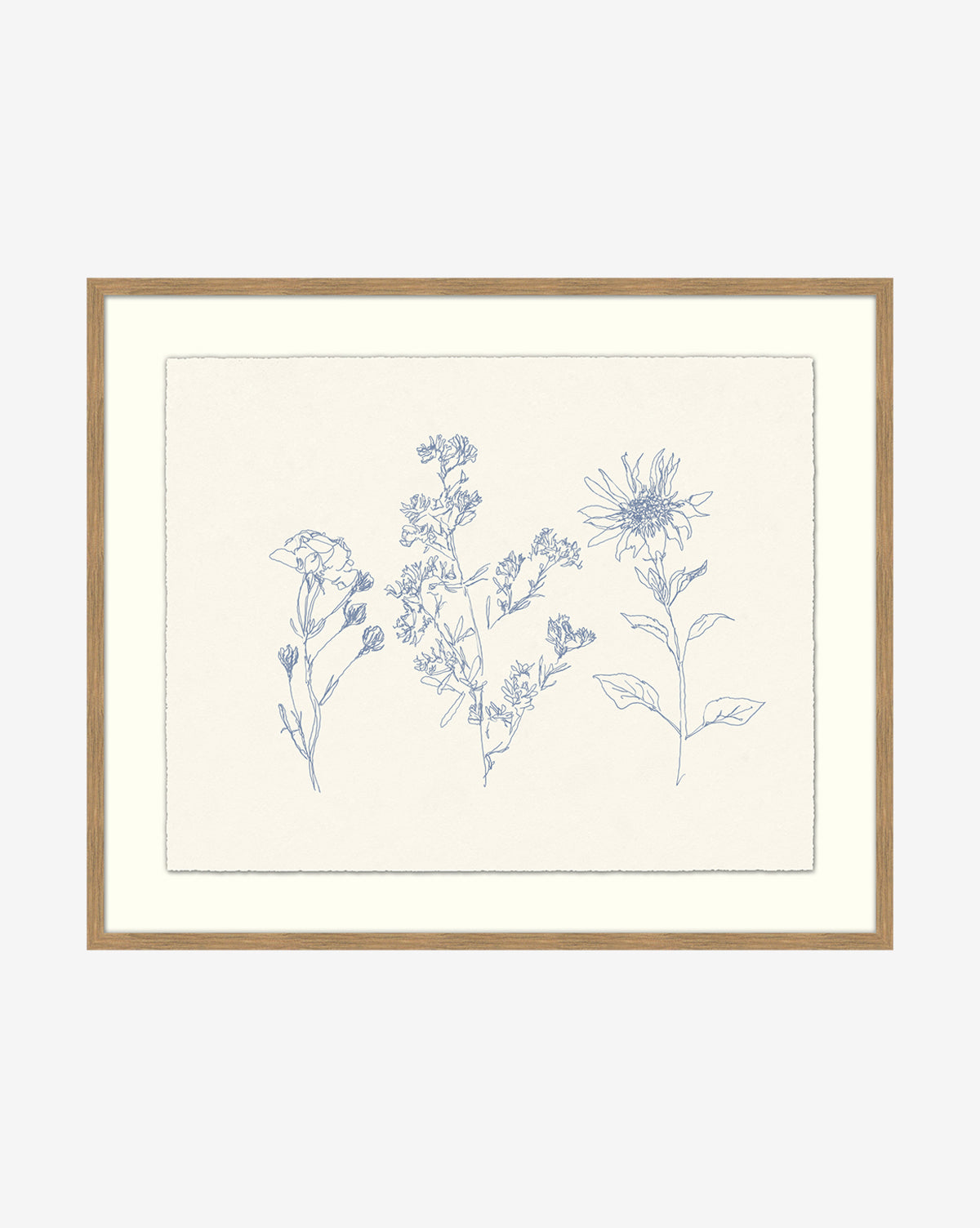Petites Fleurs is a framed botanical print with three delicate blue line wildflower drawings on an off-white background, perfect as elegant flower wall art for any room.